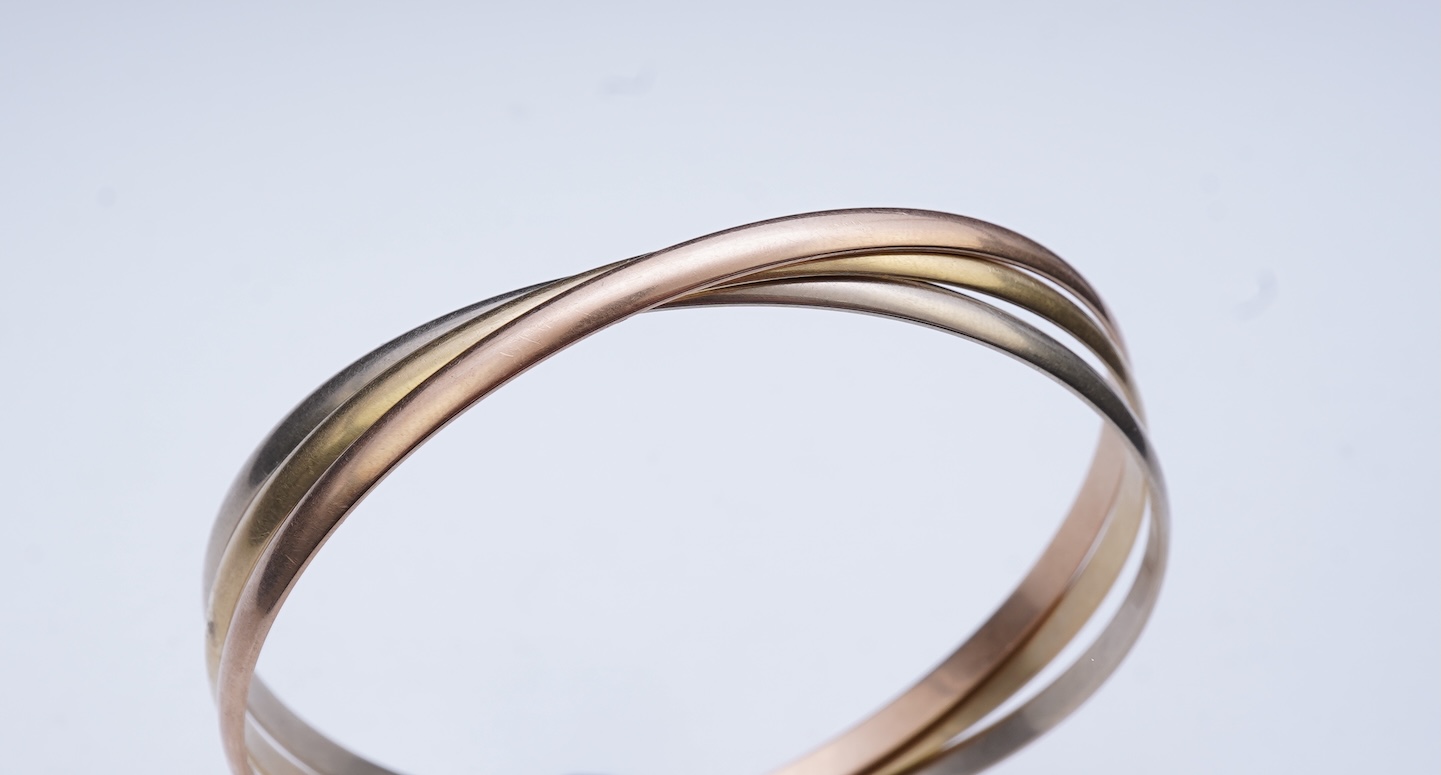 Cartier, a gold bangle, 'Trinity de Cartier'
